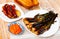 Grilled calcots served with romesco sauce, botifarra and toasts