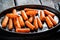 Grilled carrots on grill