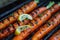 Grilled carrots in a herbal marinade on a grill plate, outdoor, top view. Grilled vegetarian food