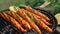 Grilled carrots in a herbal marinade on a grill plate, outdoor, top view. Grilled vegetarian food