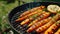 Grilled carrots in a herbal marinade on a grill plate, outdoor, top view. Grilled vegetarian food