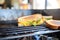 grilled cheese cooking in pan, golden brown crust visible