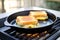 grilled cheese cooking in pan, golden brown crust visible