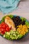 Grilled chicken with avocado, tomatoes, sweet corn, beans and lettuce. Southwestern colorful chicken salad with creamy cilantro dr