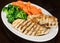 Grilled Chicken Breast, Broccoli and Carrots on a Plate