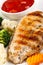 Grilled chicken breast fillet with stew vegetables and sauce