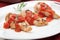 Grilled chicken breast with tomato tarragon sauce.