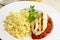 Grilled chicken escalope with tomato sauce and pasta