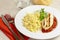 Grilled chicken escalope with tomato sauce and pasta