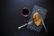 Grilled chicken fillets on slate plate with rosemary, wine and spices on dark wooden background. Top view. Flat lay. Copy space