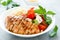 Grilled chicken lunch bowl with orange juice dressing, pasta and caprese salad