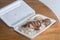 Grilled Chicken meat rice with black soy sauce egg on polystyrene box.