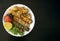 Grilled chicken shashlik, lamb, beef kofta kebab, tomato, parsley on white plate on dark wooden background