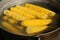 Grilled Corn for sale on the street. Corn baked with herbs and spices.