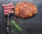 Grilled delicious ribeye steak, spices and pieces of medium steak on fork on grey background. Top view