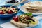 Grilled eggplant, tomatoes and feta cheese salad with flatbread, mediterranean cuisine.