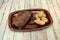 Grilled entrecote in sauce garnished with boiled potatoes