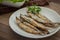 Grilled fish capelin or shishamo on plate