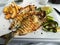 Grilled fish dish sea bream restaurant service