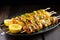 grilled fish skewer covered in a tangy orange glaze