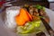 Grilled fish with white rice and fresh vegetables and fork with knife. Asian cuisine concept.