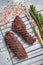 Grilled Flap steak flank cut and Machete skirt steak on grill with herbs. Gray background. Top view