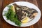 Grilled flounder on the white plate