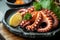 Grilled Galician octopus leg with sauce. black plate. Traditional Mediterranean dish. Octopus dish \\\