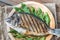 Grilled gilt-head bream with fresh arugula