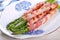 Grilled green asparagus wrapped in bacon