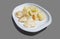 Grilled hake with boiled potatoes on plate