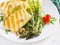 Grilled halloumi cheese salad with tomatoes and asparagus on plate