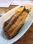 Grilled hokke with grated white radish and lemon wedge