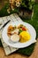 Grilled Jerk Spiced Fillet Fish with rice, dip and salad served in plate with knife and fork isolated on napkin side view of