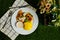 Grilled Jerk Spiced Fillet Fish with rice, dip and salad served in plate with knife and fork isolated on napkin top view of korean