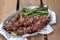 Grilled lamb kebabs with broccolini