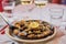 Grilled limpets served with lemon - traditional seafood on Madeira island, Portugal