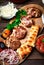 Grilled meat. Close-up selective focus. Meat balls or cutlets - Turkish kofte made from lamb and beef with cheese and spices. On a