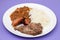 grilled meat, sausage, lentils and boiled rice