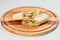 Grilled Meat shawarma roll served on wooden plate