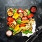 Grilled multicolored vegetables, aubergines, zucchini, pepper wi