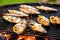 grilled mussels coated in garlic butter, steaming slightly