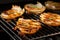 grilled onion slices being flipped on a barbecue grill