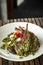 Grilled organic lamb chops meal with chimichurri sauce in argentina