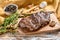 Grilled outside skirt steak on a chopping Board. White background. Top view