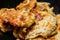 Grilled pieces of pork in a plate, close-up