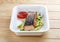 Grilled pink salmon on a bed of zucchini. Healthy food. Takeaway food. On a wooden background