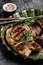 Grilled pork chop steak on metal plate. Keto Paleo diet menu. Top view