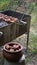 Grilled pork kebab putting from skewer into pottery bowl