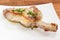 Grilled pork loin chop with rib on dish closeup